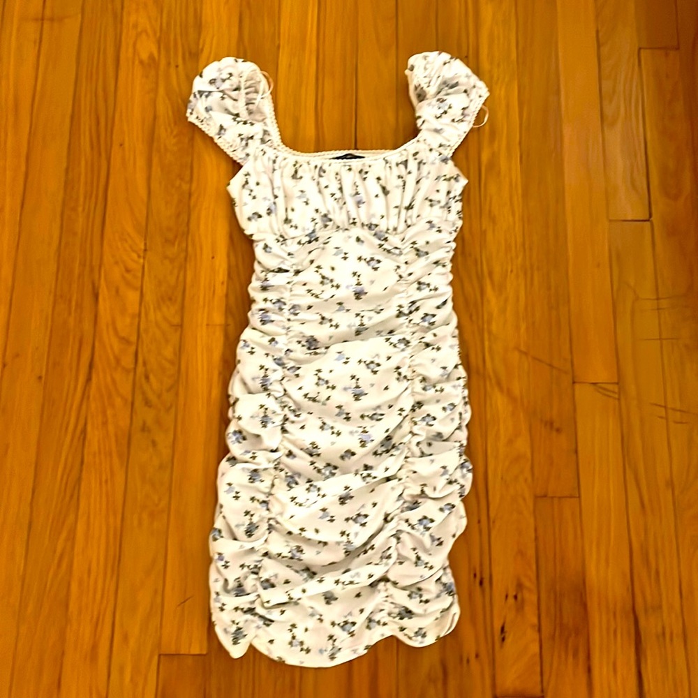 Body con floral dress from Urban Outfitters. Perfect t cottagecore piece.